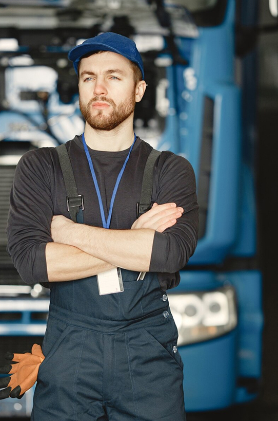ELEMARI mechanic in front of a truck